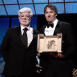 Cannes, France. 26th May, 2024. Sean Baker receives the Palme D'Or Award for Anora presented by George Lucas during the Closing Ceremony at the 77th annual Cannes Film Festival at Palais des Festivals on May 25, 2024 in Cannes, France.Photo by David NIVIE