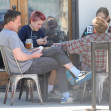 PREMIUM EXCLUSIVE Smiling Ben Affleck enjoys playing cards with kids