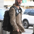 *EXCLUSIVE* A scruffy Keanu Reeves touches down at JFK!