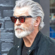*PREMIUM-EXCLUSIVE* *MUST CALL FOR PRICING* The 'Silver Fox', James Bond's Pierce Brosnan takes a short cut through London's red light district in London's Soho after dining at the Groucho Club with friends.