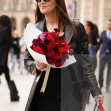 Monica Bellucci carries flowers while out in Paris