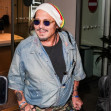 Johnny Depp steps out the Milan airport after the Rome film festival before a TV interview on channel 9