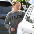 EXCLUSIVE: Renee Zellweger steps out with a messy head of hair after arriving home after doing a two week press tour around the world for her new movie