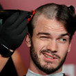 A fan gets his head shaved for a free preview of Yorgos Lanthimos’s new film 'Bugonia', in California
