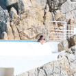 Michelle Rodriguez takes in the French sunshine as she relaxes by the pool at the Cap Eden Roc hotel during 79th Cannes Film Festival.