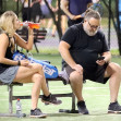 *EXCLUSIVE* Russell Crowe gets cozy with a younger woman while spending time at the tennis courts in Sydney!
