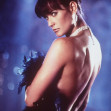 Demi Moore în rolul Erin Grant, în Striptease