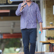 *EXCLUSIVE* Peace!  A relaxed and barefoot Simon Baker is pictured having breakfast with his son in Sydney.
