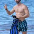 *EXCLUSIVE* Patrick Schwarzenegger shows off his fit abs as he hits the beach in Hawaii