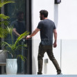 Jennifer Lopez and Ben Affleck are seen on the upstairs balcony of her rental home in Miami