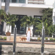JLo is ethereal in white while Ben Affleck puffs on a cigarette as couple relax at lavish Miami Beach mansion.