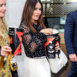 *EXCLUSIVE* Salma Hayek is seen eating popcorn as she leaves the premiere of The Hitman's Wife's Bodyguard.