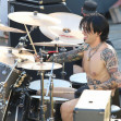 EXCLUSIVE: Sebastian Stan is the splitting image of Tommy Lee while performing drums as Motley Crue filming the Pam and Tommy docu-series.