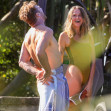 EXCLUSIVE: *NO DAILYMAIL ONLINE* Simon Baker Suffers A Cheeky Wetsuit Wardrobe-Malfunction During A Surf Session With Girlfriend Laura May Gibbs In Byron Bay