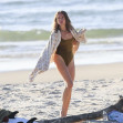 EXCLUSIVE: *NO DAILYMAIL ONLINE* Simon Baker Suffers A Cheeky Wetsuit Wardrobe-Malfunction During A Surf Session With Girlfriend Laura May Gibbs In Byron Bay