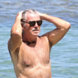 EXCLUSIVE: Pierce Brosnan takes off his shirt and takes a dip while in Hawaii