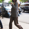 Dakota Johnson arrives at The Bowery Hotel in a plaid blazer