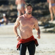EXCLUSIVE: *NO DAILYMAIL ONLINE*Pecs Appeal! Chris Hemsworth Shows Off All The Benefits Of His Very Own 'Centr Fit' Workout App, Exhibiting His Gym-Honed Physique For All To See, During A Beach Outing In Byron Bay!