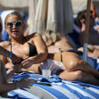 Kate Hudson looks amazing in a little black bikini as she hits the beach in Miami