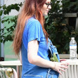 EXCLUSIVE: Sophie Turner wears a shirt with her name on it and cozy overalls as she goes for lunch with husband Joe Jonas and a large group of friends in the Wynwood area of Miami