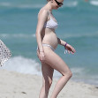 PREMIUM EXCLUSIVE:  A beaming Sophie Turner steps out in a bikini, proudly confirming she is pregnant with her second child