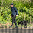 *EXCLUSIVE* *WEB MUST CALL FOR PRICING* Hugh Laurie looks unrecognisable in a tracksuit, a beanie hat and trainers and a full bushy beard as he was spotted taking his dog for a walk in London.