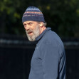 *EXCLUSIVE* *WEB MUST CALL FOR PRICING* Hugh Laurie looks unrecognisable in a tracksuit, a beanie hat and trainers and a full bushy beard as he was spotted taking his dog for a walk in London.