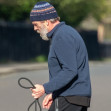 *EXCLUSIVE* *WEB MUST CALL FOR PRICING* Hugh Laurie looks unrecognisable in a tracksuit, a beanie hat and trainers and a full bushy beard as he was spotted taking his dog for a walk in London.
