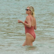 *PREMIUM-EXCLUSIVE* Charlize Theron sets pulses racing in a red hot one-piece bathing suit *WEB EMBARGO UNTIL DECEMBER 1, 2021 6:15 PM ET*