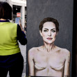 World Breast Cancer Day. Mural by Angelina Jolie with signs of mastectomy - Milan, Italy - 19 Oct 2022