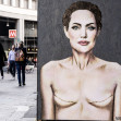 World Breast Cancer Day. Mural by Angelina Jolie with signs of mastectomy - Milan, Italy - 19 Oct 2022