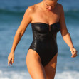 *EXCLUSIVE* Lara Worthington wears a black one piece swimsuit as she goes for an afternoon swim at Bondi Beach with her best pal Phoebe Tonkin in Sydney.