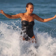 *EXCLUSIVE* Lara Worthington wears a black one piece swimsuit as she goes for an afternoon swim at Bondi Beach with her best pal Phoebe Tonkin in Sydney.