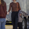 EXCLUSIVE: Emma Stone stops at a drive-through drink store for refreshments after filming in New Orleans