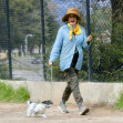 EXCLUSIVE: Actress Andie MacDowell is barely recognizable walking her pup at the Silverlake Reservoir walking trails