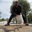 Arnold Schwarzenegger has taken it upon himself to fill two potholes