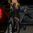 Pamela Anderson arrives with a smile on her face at the Mugler H&amp;M Global Launch Event in NYC