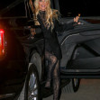 Pamela Anderson arrives with a smile on her face at the Mugler H&amp;M Global Launch Event in NYC
