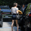 EXCLUSIVE: Mila Jovovich shows of an interesting new hairstyle as she arrives at the Four Seasons