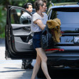 EXCLUSIVE: Mila Jovovich shows of an interesting new hairstyle as she arrives at the Four Seasons