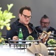 *EXCLUSIVE* The American Film Director Quentin Tarantino enjoys a cigar on the terrace of the Carlton Hotel during the 76th Cannes Film Festival.
