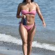 Eva Longoria seen showing off her figure in a pink bikini whilst on a beach in Marbella with her son