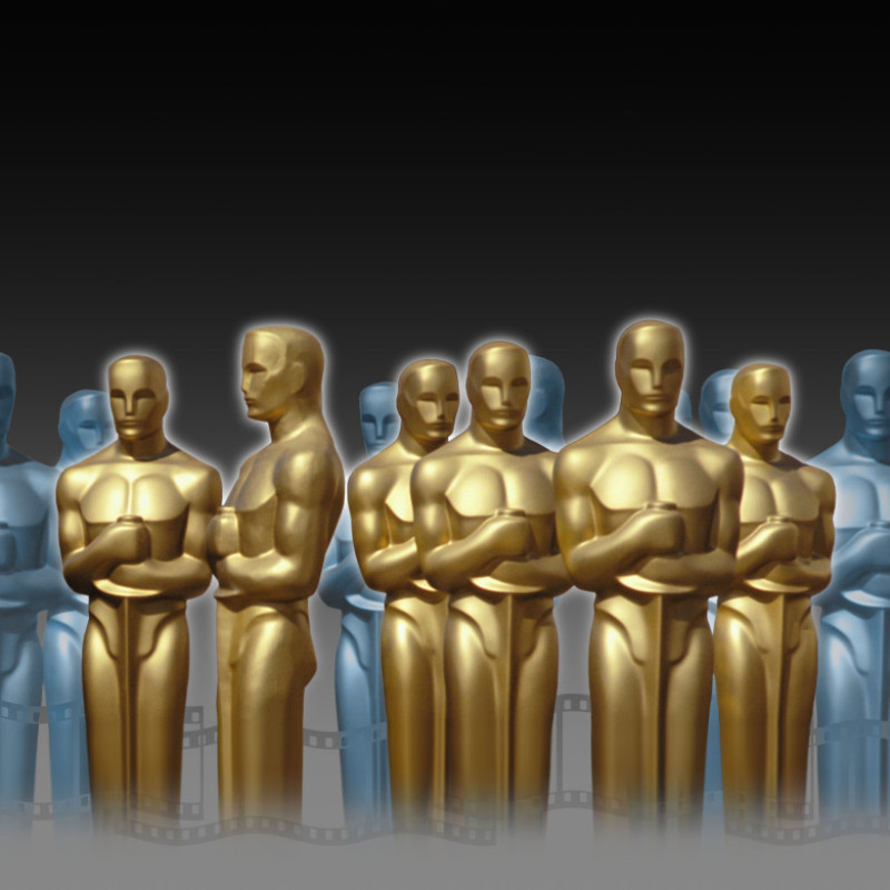 Golden and bluish Oscar statues in an imaginary setting