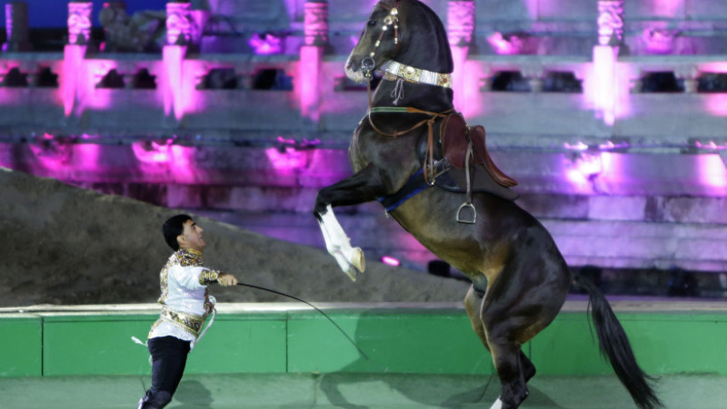 Turkmenistan's President Gurbanguly Berdimuhamedov delivers a speech next to China's President Xi Jinping in Beijing
