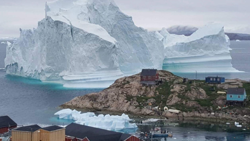 Iceberg grounded outside village in northwestern Greenland