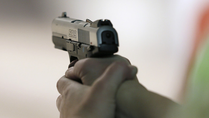 Firearms Enthusiasts Practice Shooting At Gun Range