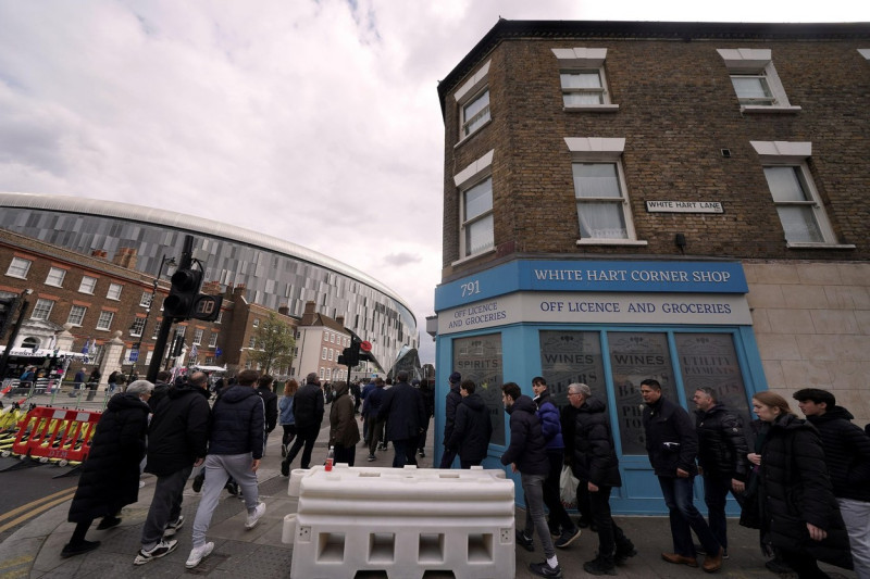 Fans arrive at the ground ahead of the Premier League match at the Tottenham Hotspur Stadium, London. Picture date: Sunday April 3, 2022.