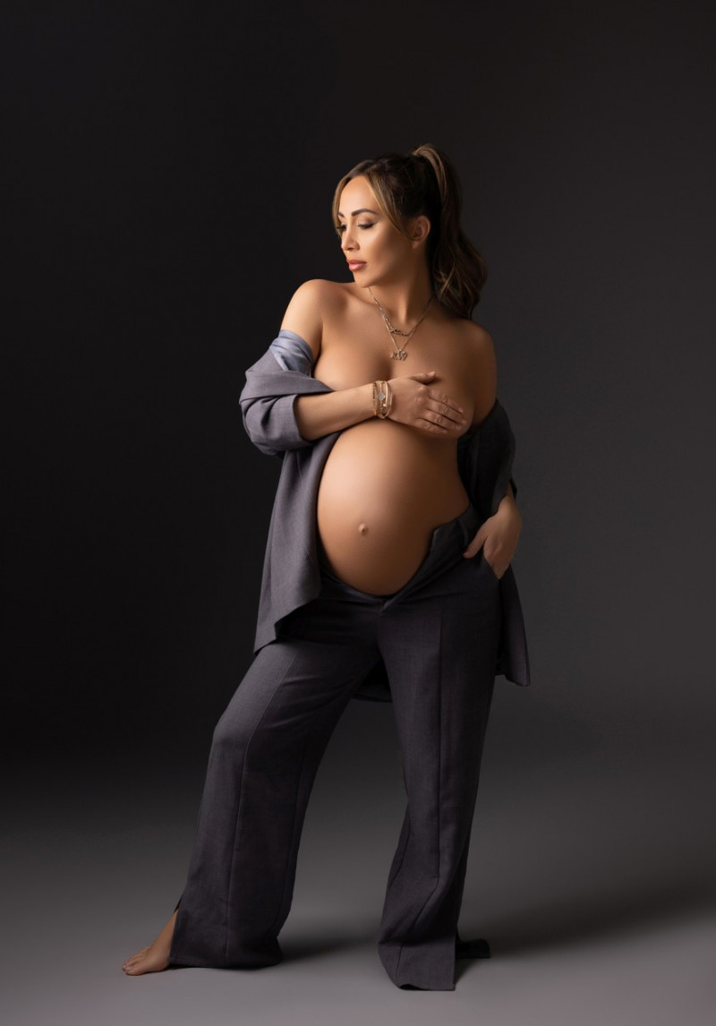EXCLUSIVE: Lauryn Goodman Shows Off Her Baby Bump In A Grey Two Piece Suit