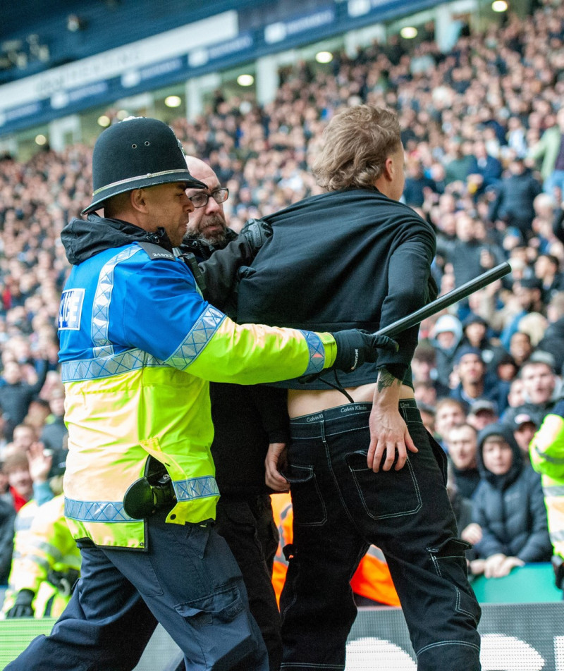 West Bromwich Albion v Wolverhampton Wanderers Emirates FA Cup A fan is arrested by police during the Emirates FA Cup Fo