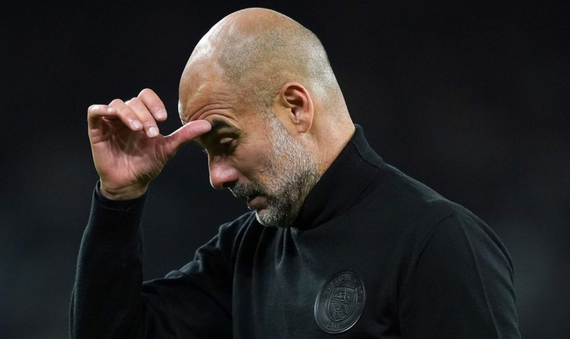 File photo dated 11-10-2022 of Manchester City manager Pep Guardiola looks frustrated after the final whistle. The game that saw them clinch their spot was actually a forgettable goalless draw in Copenhagen in which Sergio Gomez was sent off, but the job